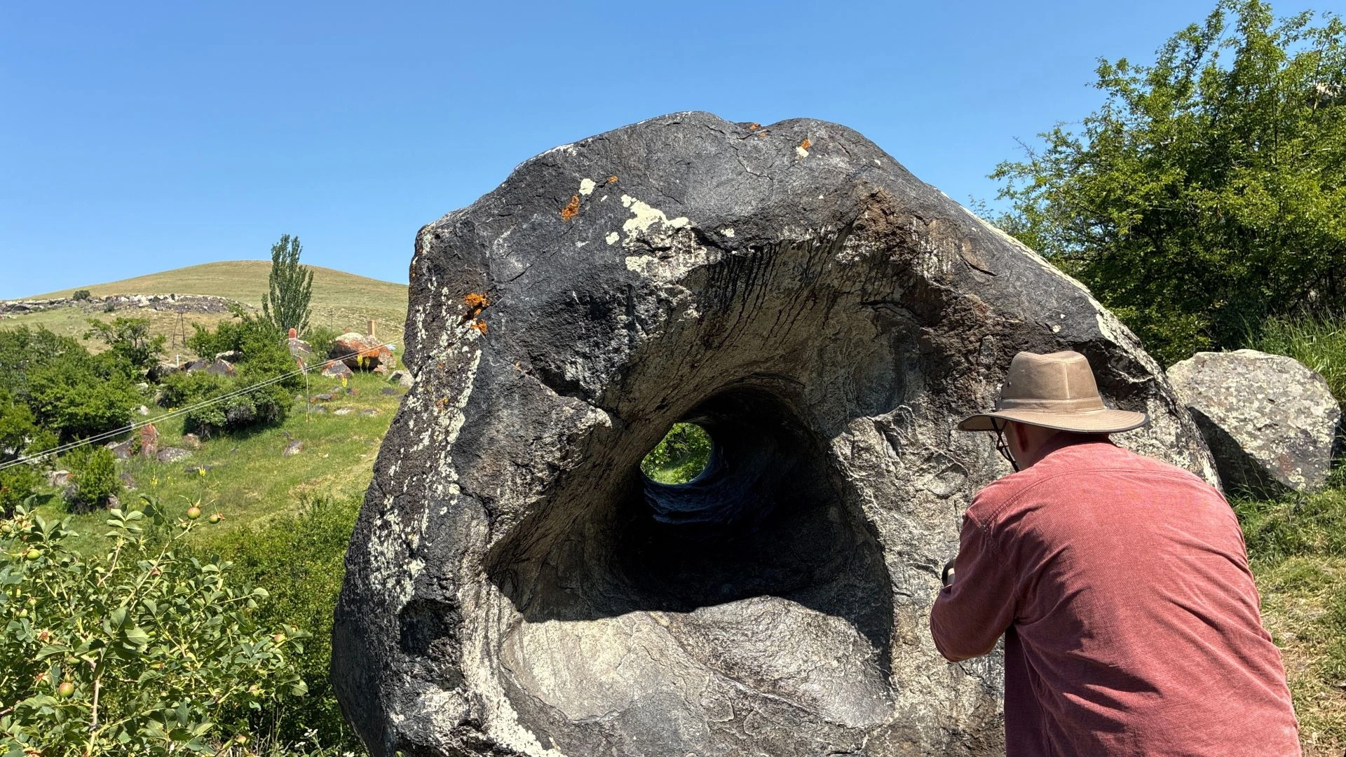 Peter photographing the "hole stone" in Hatsik Village