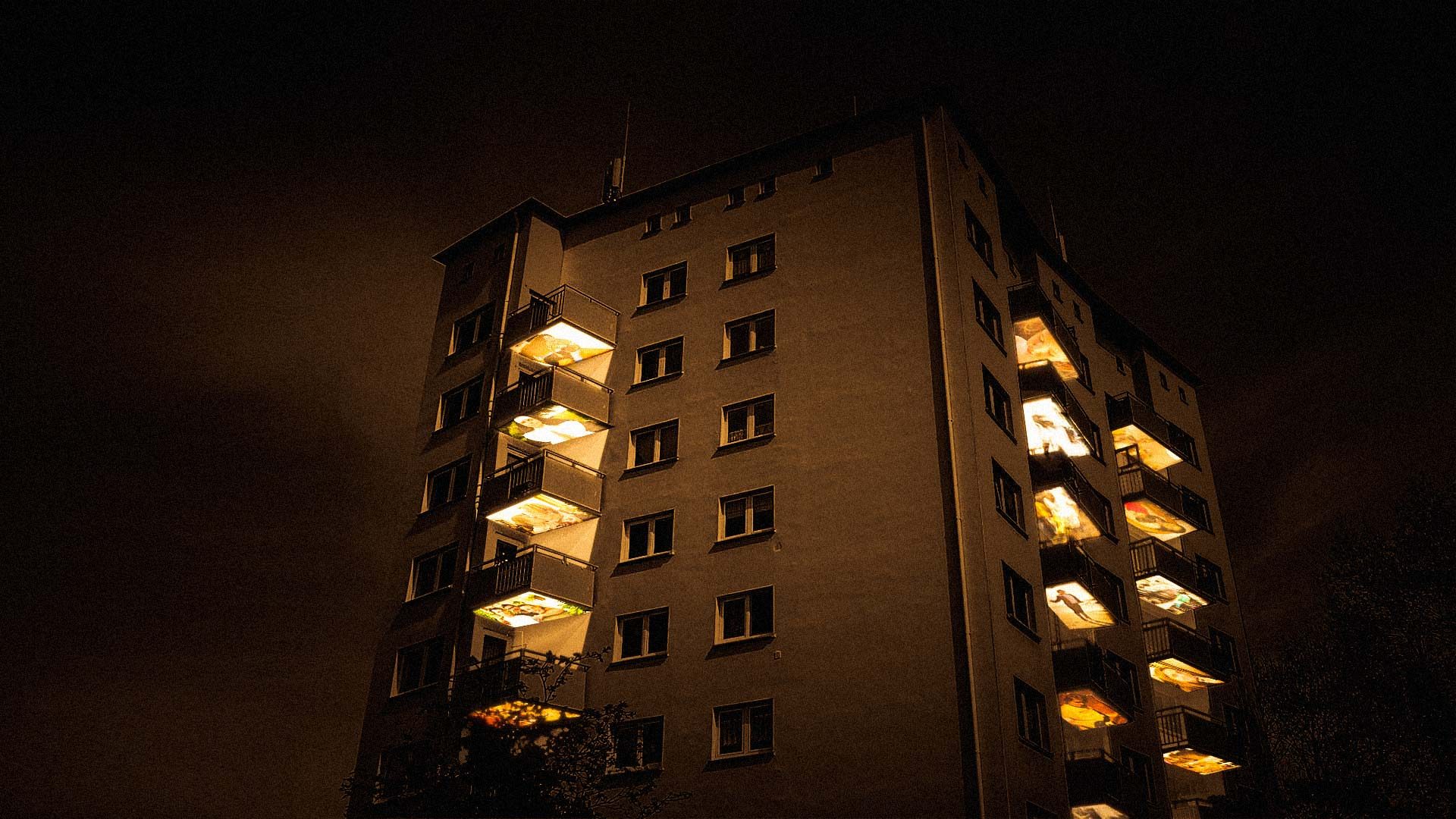 Balconies of a high-rise building turn into projection screens for a media installation